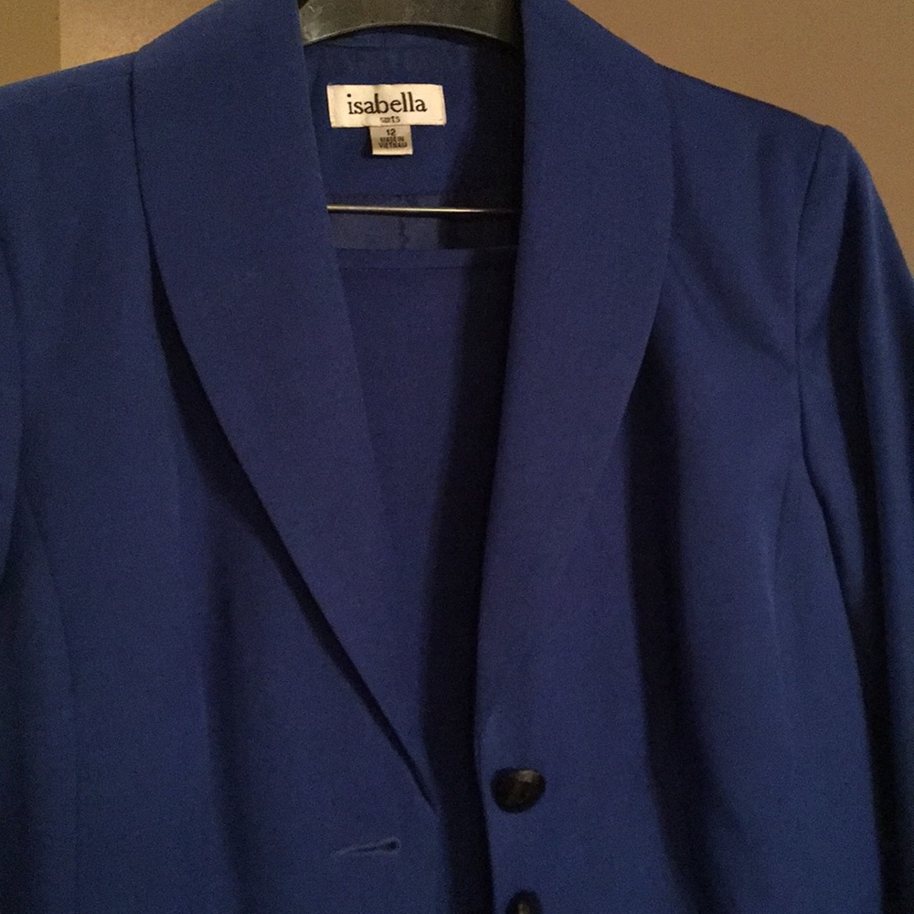 Royal blue suit, black lace accents and buttons.